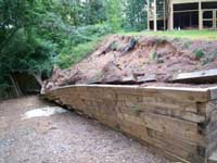 Failing treated timber wall