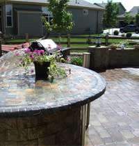 Custom outdoor kitchen with pavers and counter top