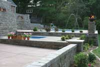 Below ground pool with retaining wall