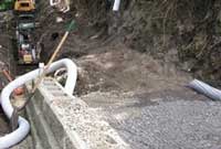 Retaining wall with drain